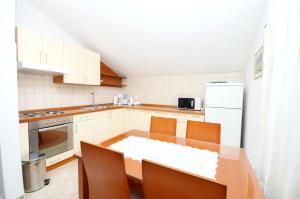 Kuchyňa alebo kuchynka v ubytovaní Apartments Brankaa