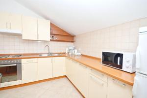 Kuchyňa alebo kuchynka v ubytovaní Apartments Brankaa