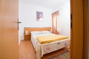 Postel nebo postele na pokoji v ubytování Apartments Ksenija