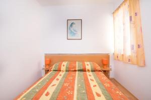 Postel nebo postele na pokoji v ubytování Apartments Ksenija