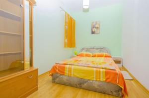 Postel nebo postele na pokoji v ubytování Apartments Ksenija