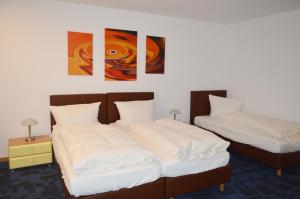 Postel nebo postele na pokoji v ubytování Hotel B8 Voerde