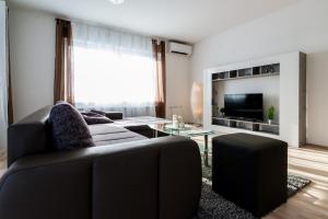 Televízia a/alebo spoločenská miestnosť v ubytovaní Ferienhaus Bucic
