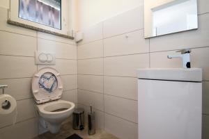 Kúpeľňa v ubytovaní Ferienhaus Bucic