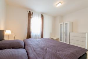 Posteľ alebo postele v izbe v ubytovaní Ferienhaus Bucic