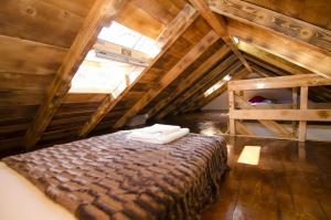 a bedroom with a bed in a attic at House Radojka in Tisno