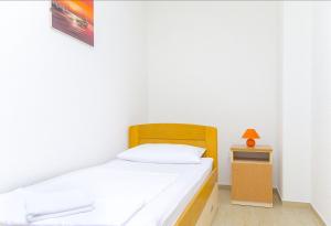 Postel nebo postele na pokoji v ubytování Apartments Tiho i Pave