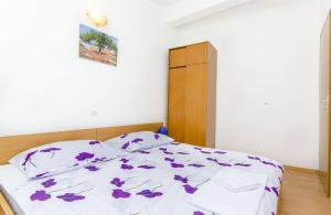 Postel nebo postele na pokoji v ubytování Apartments Tiho i Pave
