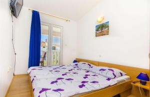 Postel nebo postele na pokoji v ubytování Apartments Tiho i Pave