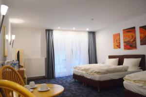 Postel nebo postele na pokoji v ubytování Hotel B8 Voerde