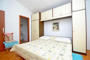 Postel nebo postele na pokoji v ubytování Apartment Ksenija