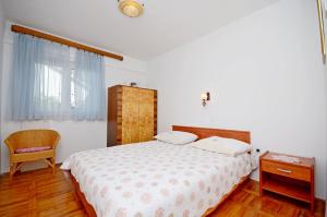 Postel nebo postele na pokoji v ubytování Apartment Ksenija