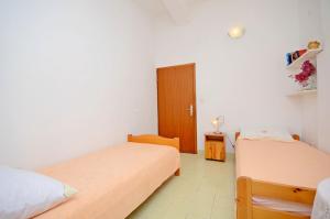 Postel nebo postele na pokoji v ubytování Apartment Ksenija