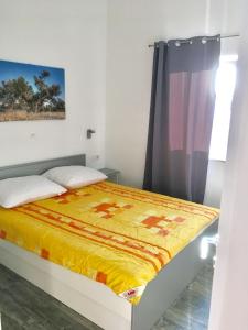 Postel nebo postele na pokoji v ubytování Apartments Suzana