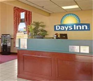 a day inn lobby with a sign on the wall at Days Inn by Wyndham Apple Valley Pigeon Forge/Sevierville in Pigeon Forge