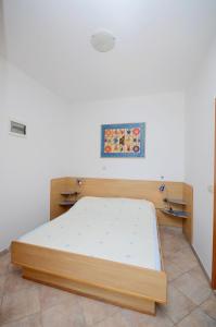 Postel nebo postele na pokoji v ubytování Apartments Jure