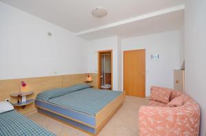 Postel nebo postele na pokoji v ubytování Apartments Jure