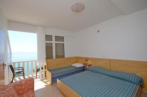Postel nebo postele na pokoji v ubytování Apartments Jure