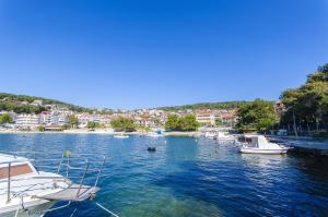 a group of boats docked in a body of water at Apartment Baturina in Trogir