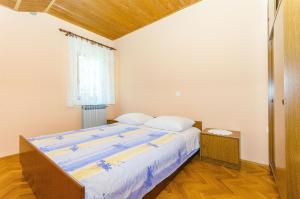 Postel nebo postele na pokoji v ubytování Apartments Marinko