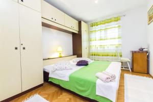 Postel nebo postele na pokoji v ubytování Apartment Zorka