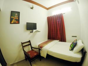 Ліжко або ліжка в номері Sapphire Club Cherai Beach Villa
