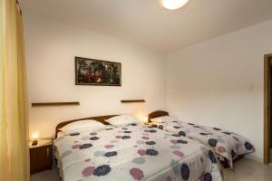 Postel nebo postele na pokoji v ubytování Apartment Mery
