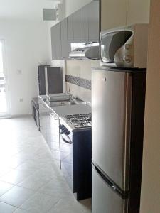 Kuchyň nebo kuchyňský kout v ubytování Apartments Mira