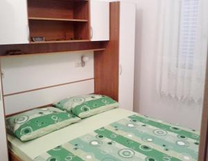 Postel nebo postele na pokoji v ubytování Apartments Mira