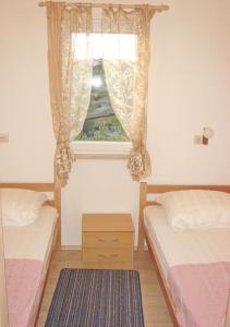 Postel nebo postele na pokoji v ubytování Apartments Mira