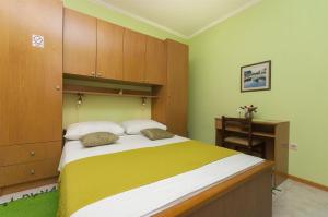 En eller flere senge i et værelse på Rooms Vlahovic