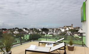 a balcony with a view of a city at ibis Styles Quiberon Centre in Quiberon