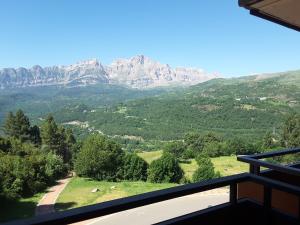 a view from the balcony of a mountain at Apartamentos Argualas in Panticosa