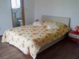 Postel nebo postele na pokoji v ubytování Apartments Mara