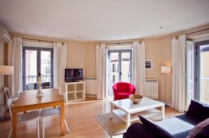 a living room with a couch and a table at Apartment in the Centre in Madrid