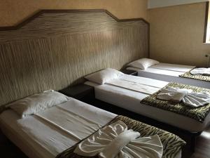 Cama o camas de una habitación en Pensiunea Doria