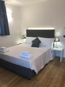 Postel nebo postele na pokoji v ubytování Corte di Pellio