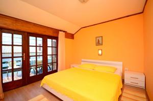 Postel nebo postele na pokoji v ubytování Apartments Ines