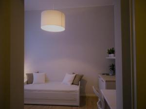 A bed or beds in a room at Appartamenti Emilio