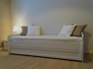 A bed or beds in a room at Appartamenti Emilio