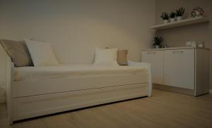 A bed or beds in a room at Appartamenti Emilio