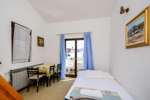 Postel nebo postele na pokoji v ubytování Apartments Dragica