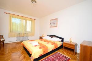 Postel nebo postele na pokoji v ubytování Apartments Dragica