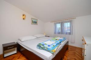 Postel nebo postele na pokoji v ubytování Apartments Dragica