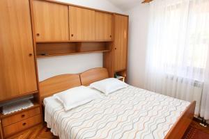Łóżko lub łóżka w pokoju w obiekcie Apartments Patricia