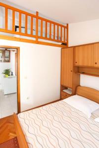 Łóżko lub łóżka w pokoju w obiekcie Apartments Patricia