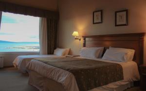 Cama ou camas em um quarto em Terrazas Del Calafate