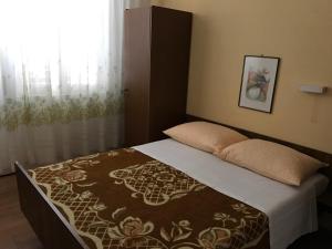 Postel nebo postele na pokoji v ubytování Guesthouse Mimas