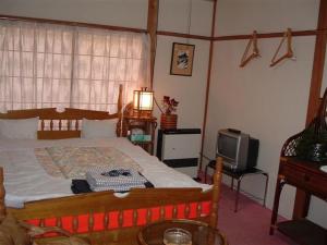 Postel nebo postele na pokoji v ubytování Onsen Inn 36So
