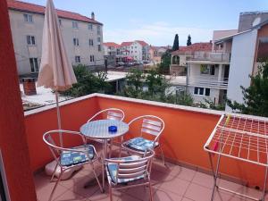 Ein Balkon oder eine Terrasse in der Unterkunft Apartmani Bartolić
